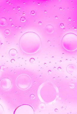 Yumuşak pembe ve beyaz gradyan zemin üzerinde açık kabarcıklar makro çekim yumuşak ışıklandırma ve düz doku oluşturan rüya kozmetik tarzı arka plan, soyut makro serin makro.