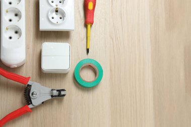 Repair tools, plumber, locksmith, electrician on a wooden background