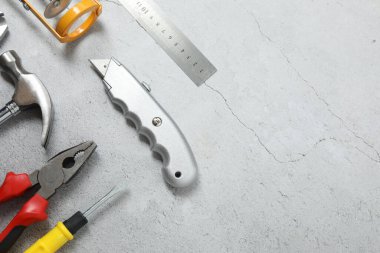 Repair tools, plumber, locksmith, electrician on concrete floor