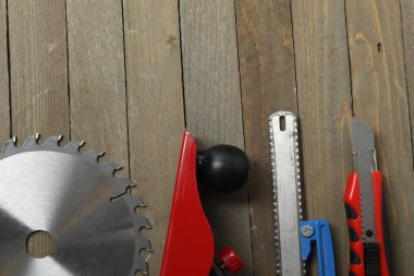 Repair tools, plumber, locksmith, electrician on a wooden background