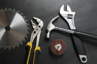 Repair tools, plumber, locksmith, electrician on concrete floor