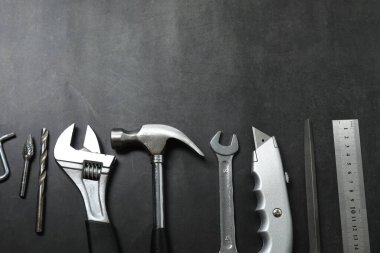 Repair tools, plumber, locksmith, electrician on concrete floor