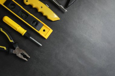 Repair tools, plumber, locksmith, electrician on concrete floor