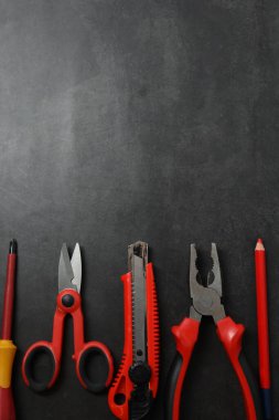 Repair tools, plumber, locksmith, electrician on concrete floor