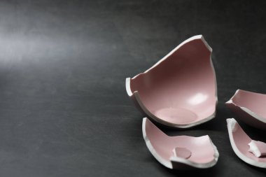 Broken dishes on the floor.