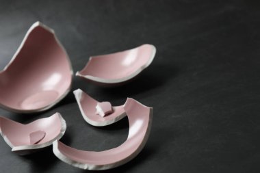 Broken dishes on the floor.