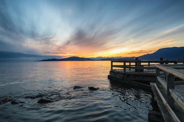 Beautiful sunset viewed from dock — Stock Photo, Image
