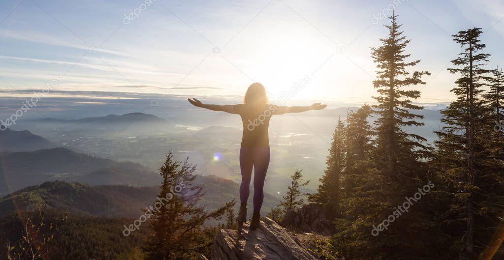 Adventurous Caucasian Adult Woman hiking in Canadian Nature