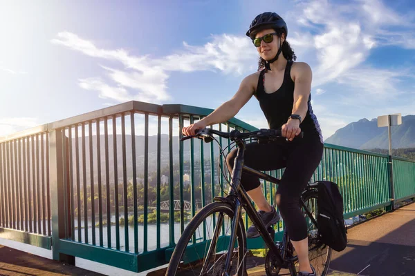 Adventurous White Caucasian Adult Woman riding a road bicycle — Stock Photo, Image