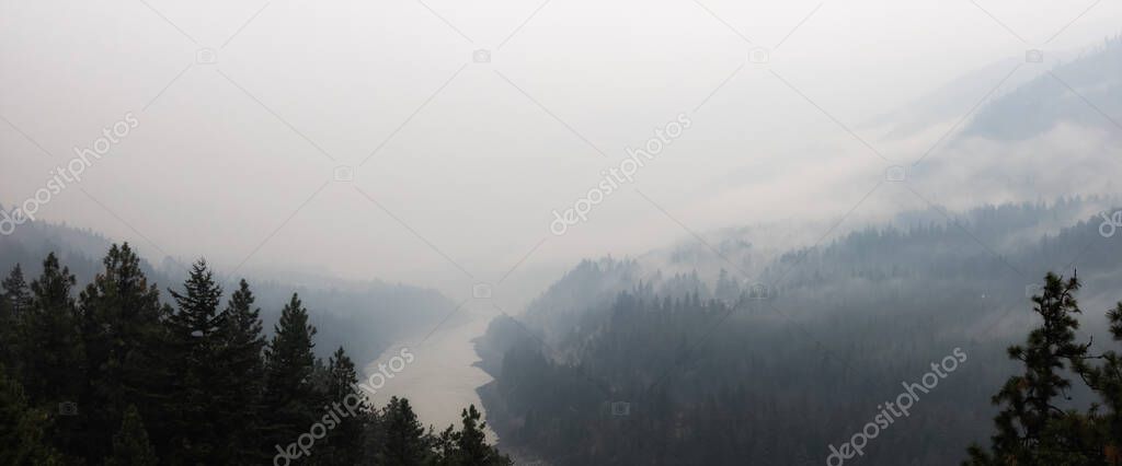 Valley covered by smoke from Forest Wildfire.