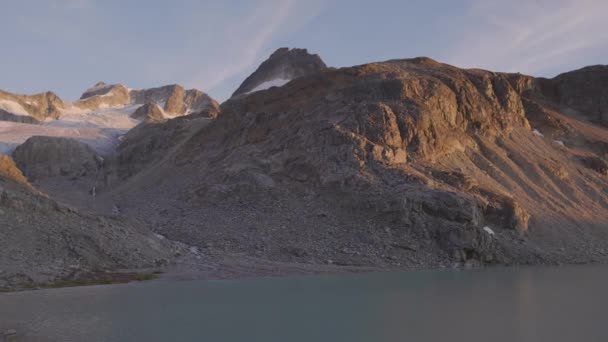 Panoramic View of Vibrant Colorful Glacier Lake up in Rocky Mountains — Stock Video