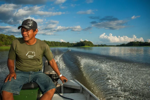 man in boat on Amazon river