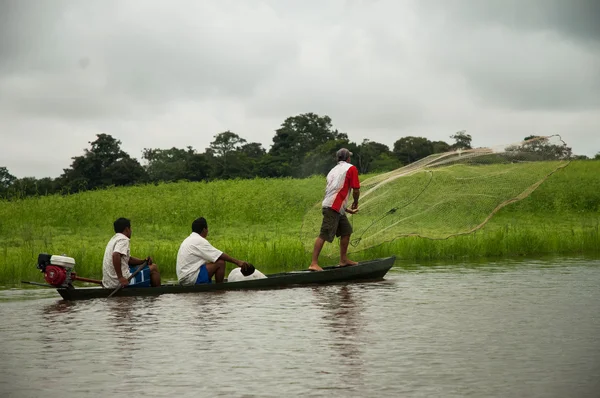 stock image men in boat on Amazon river