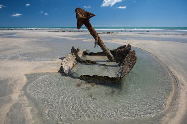 Beach view with rusty metal parts — Stock Photo, Image