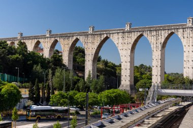 Beautiful view to old historic big aqueduct in central Lisbon, Portugal clipart