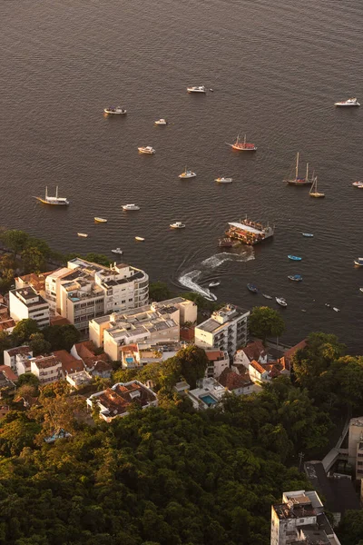 Beautiful view from above from Sugar Loaf mountain to buildings and boats in Urca, Rio de Janeiro, Brazil