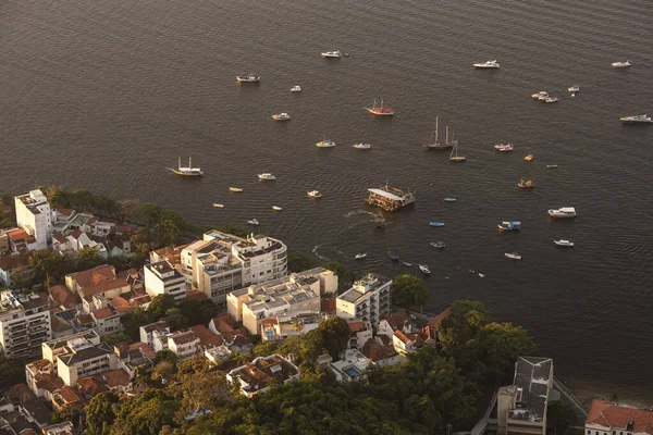 Beautiful view from above from Sugar Loaf mountain to buildings and boats in Urca, Rio de Janeiro, Brazil