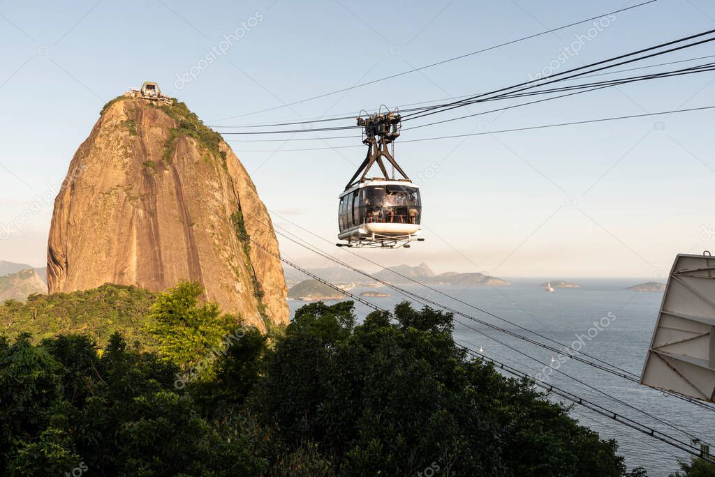 Beautiful view to Sugar Loaf mountain cable car over rainforest in Rio de Janeiro, Brazil