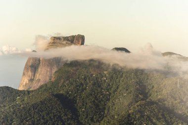 Beautiful view from Christ the Redeemer to green rainforest mountains and clouds, Rio de Janeiro, Brazil
