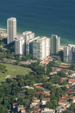Beautiful view to residential buildings and green area in So Conrado seen from Pedra Bonita Peak, Tijuca Park, Rio de Janeiro, Brazil.