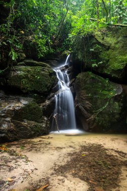 Beautiful atlantic rainforest waterfall in green Tijuca Forest Park, Rio de Janeiro, Brazil