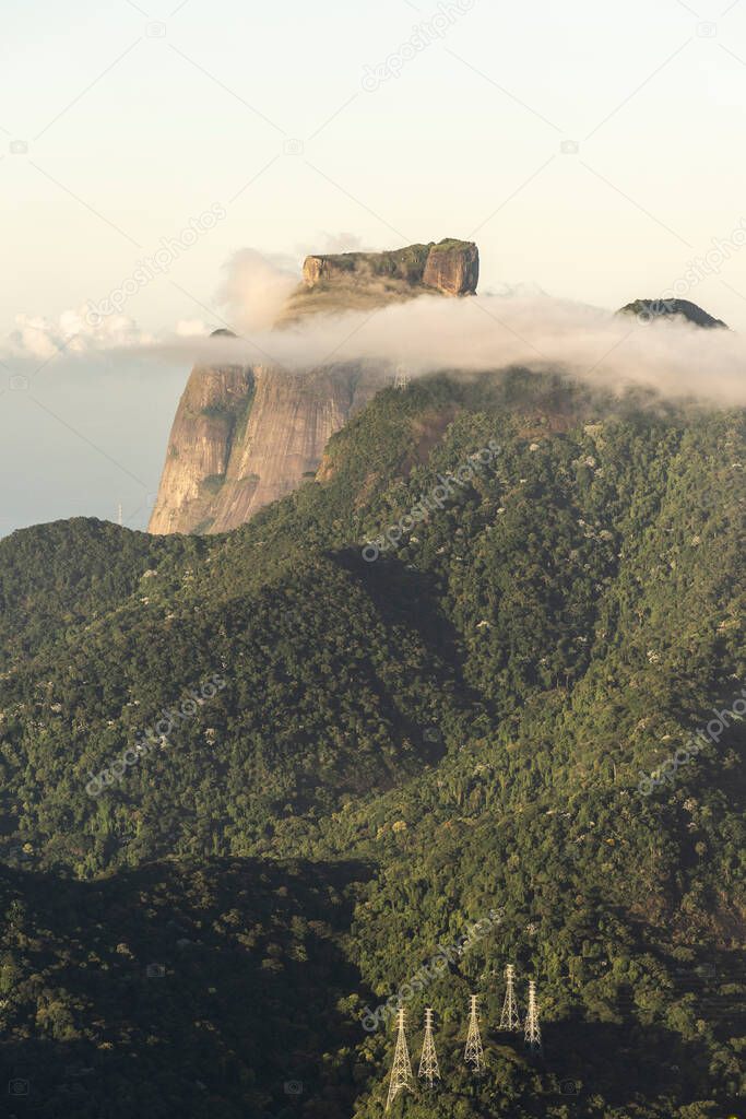 Beautiful view from Christ the Redeemer to green rainforest mountains and clouds, Rio de Janeiro, Brazil