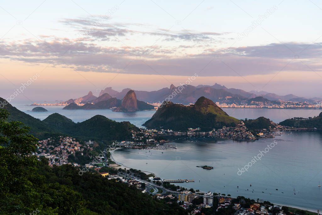 Beautiful view to layers of mountains on red sunrise light in Rio de Janeiro, Brazil
