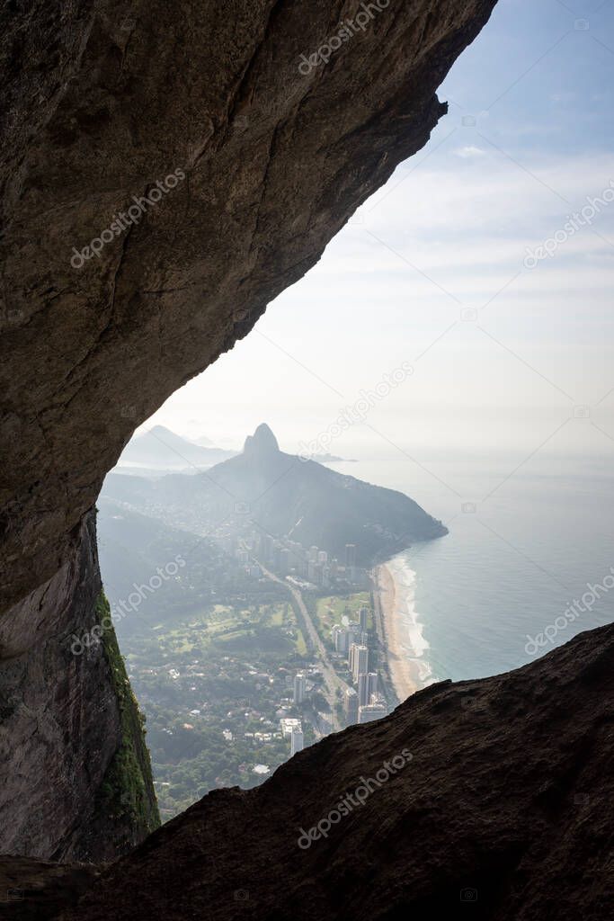 Beautiful mountani rainforest landscape seen from rocky cave, Rio de Janeiro, Brazil