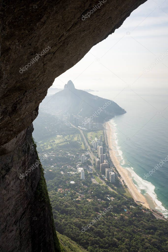 Beautiful mountani rainforest landscape seen from rocky cave, Rio de Janeiro, Brazil