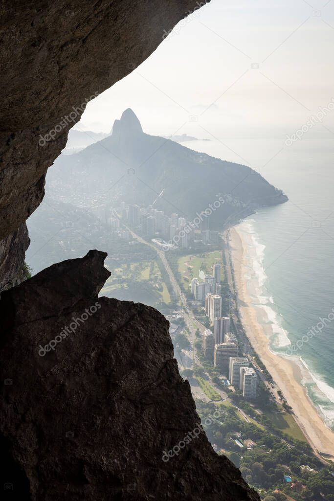 Beautiful mountani rainforest landscape seen from rocky cave, Rio de Janeiro, Brazil