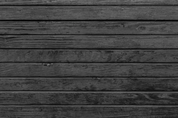 Horizontaler schwarzer Holzhintergrund. Alter dunkler Holzhintergrund mit schwarzer Holzstruktur. Strukturplatte aus dunklem Holz mit horizontalen Dielen. — Stockfoto