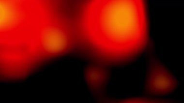 Siyah arkaplanda turuncu kırmızı ışık sızıntısı soyut animasyon. Parlayan turuncu ışık sızıntısı hareketi yumuşak bulanık animasyon. Sıcak turuncu ışık parlaması soyut bir eğilim gösterir. 4K Video