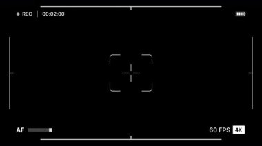 Kayıt göstergesi, zaman göstergesi, otomatik odaklama çubuğu, 4K, 60fps görüntü ve pil simgesi ile siyah arkaplan üzerine modern kamera görüntüleyicisi. 4K Video