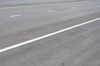 Gri asfalt yol yüzey dokusu arkaplanı.