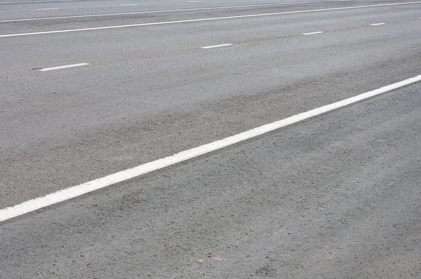 Gri asfalt yol yüzey dokusu arkaplanı.