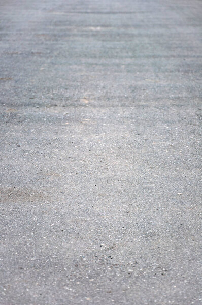 Grey asphalt road surface texture background.