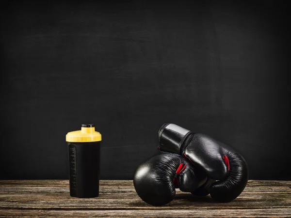 Boxing gloves on wooden background