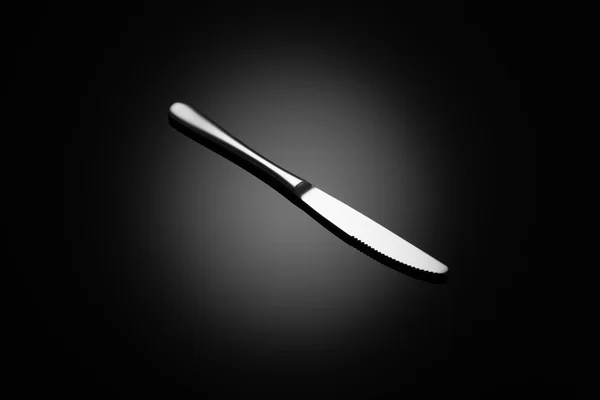 Black food background with knife — Stock Photo, Image