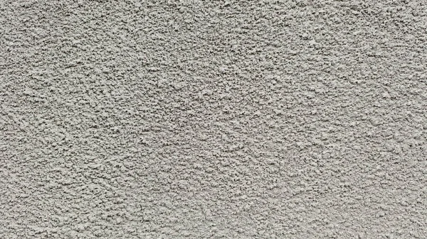 desenli bir yüzey. gri bir beton ya da sıva duvarı.