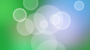 Yumuşak ve zarif bir hareket arka planında süzülen beyaz bokeh daireli yeşil ve mavi renkli bir gradyan var. Profesyonel sunumlar, meditasyon görselleri ya da yaratıcı video projeleri için sakin bir zemin olarak ideal.