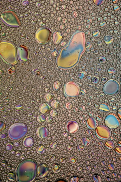 Regenbogenöl Und Wasser Abstrakte Hintergrundtextur Ölblasen Und Kleckse Mit Vielen — Stockfoto