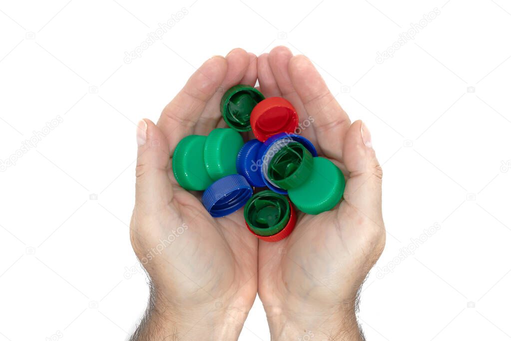 hands holding plastic bottles caps for recycling, environment conservation concept, isolated on white background