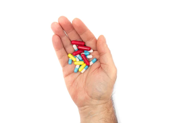 Uma Mão Homem Com Pílulas Várias Cores Fundo Branco Conceito — Fotografia de Stock