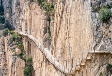 El Caminito del Rey (The King's Little Path). A walkway, pinned along the steep walls of a narrow gorge in El Chorro, near Ardales in the province of Malaga, Spain clipart