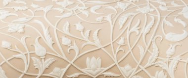 detailed surface of the wall with beautiful, decorative flowers. Background