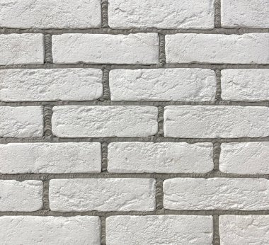 Duvar dekorasyonu için dekoratif fayanslardan gri dikişli beyaz tuğla duvar. Arkaplan, doku