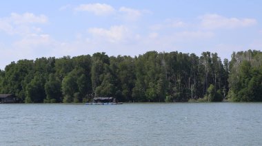 the boat is on the lake