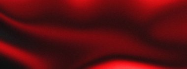 Zengin, koyu kırmızı kumaşlı, kıvrımlı, çarpıcı ışıklandırmayla aydınlatılmış, parlak gölgeler ve gölgeler yaratan bir yakın çekim..