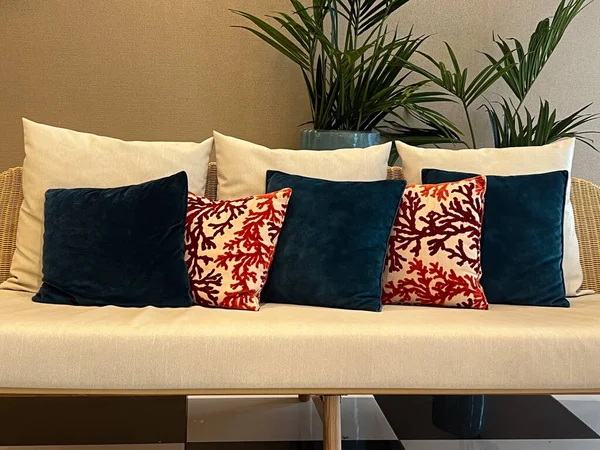 cozy sofa with decorative pillows and plant, christmas interior design concept