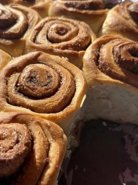 warm cinnamon rolls fresh from oven, golden brown, sweet dessert concept
